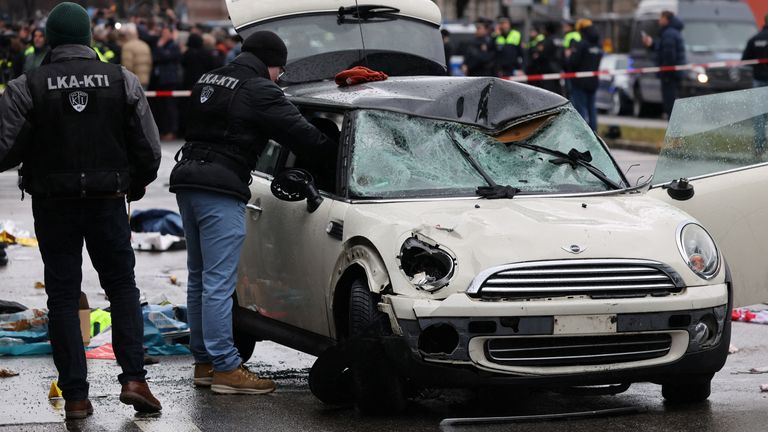 Police work at a car which drove into a crowd in Munich, Germany, February 13, 2025, injuring several people. REUTERS/Wolfgang Rattay