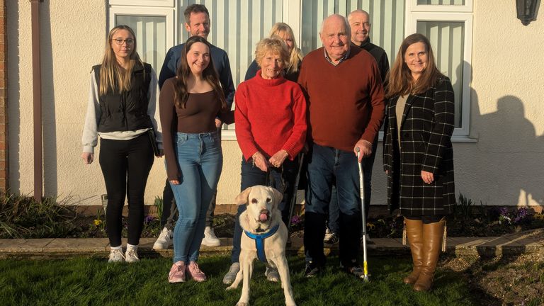 Daisy the labrador reunited with the Potter family. Pic: RSPCA / PA