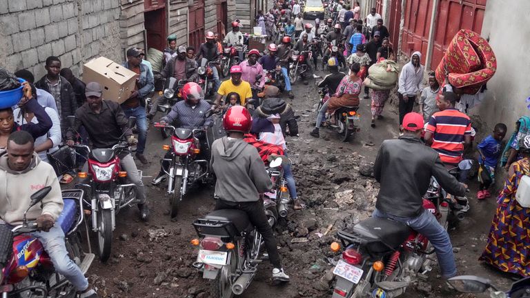 People rush to shop in downtown Goma after the M23 rebels advanced into the city. Pic: AP