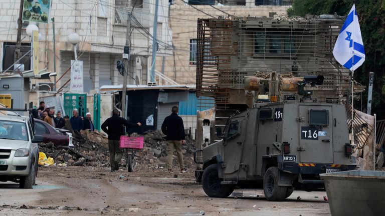 An Israeli military vehicle operates at a checkpoint on the day of an Israeli raid in Jenin, in the Israeli-occupied West Bank.
Pic: Reuters