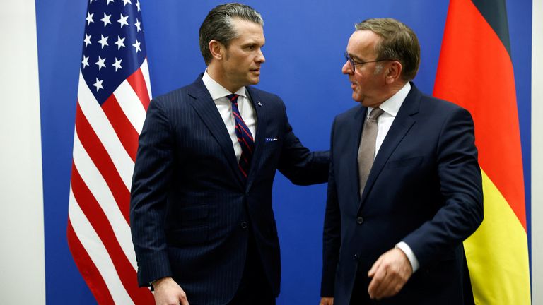 Pete Hegseth stands with German defence minister Boris Pistorius.
Pic: Reuters/Johanna Geron/Pool