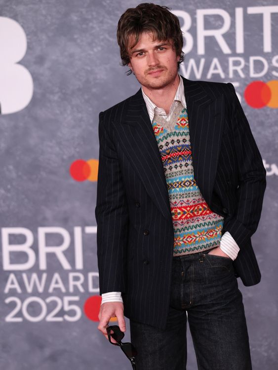 Rarely do you see a knitted tank top on the red carpet. Joe Keery, aka Djo, hasn't let that put him off. Pic: Reuters