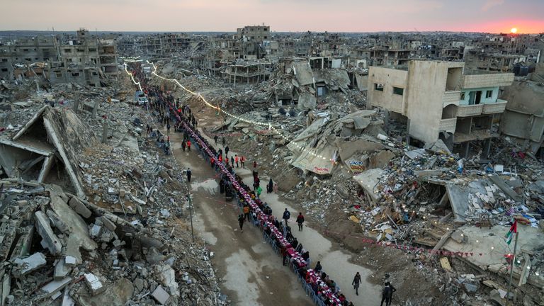 Palestinians gather among the rubble for iftar, the fast-breaking meal, on the first day of Ramadan in Rafah, in the south of the enclave.
Pic: AP/Abdel Kareem Hana