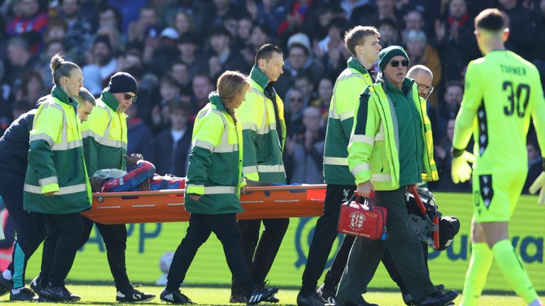 Crystal Palace's Jean-Philippe Mateta is substituted off on a stretcher during the English FA Cup soccer match between Crystal Palace and Millwall at Selhurst Park, London, England, Saturday, March 1, 2025. (AP Photo/Ian Walton)
