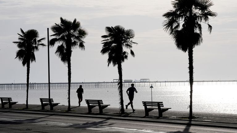 Joggers run along the sea front in Southend-on-Sea, Essex.
Pic: PA