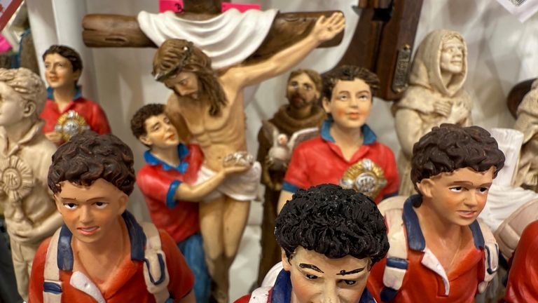 Figures of Carlo on sale at a souvenir store ahead of his canonisation. Pic: Christoph Sator/picture-alliance/dpa/AP Images