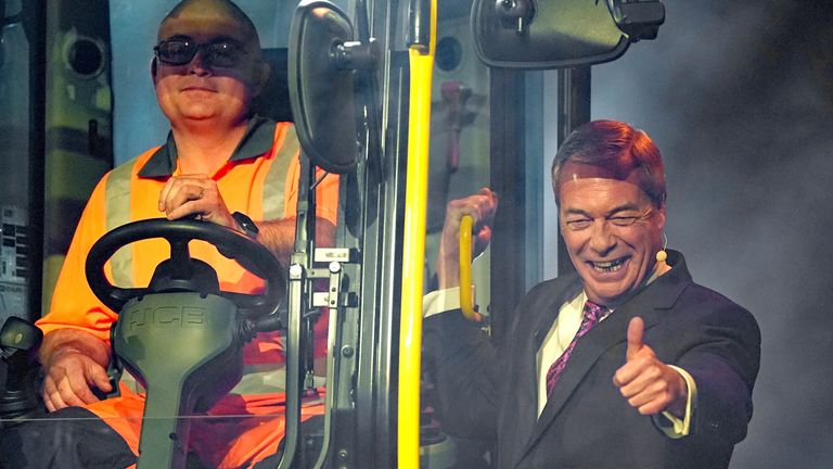 Nigel Farage arrives on a JCB digger.  Pic: PA