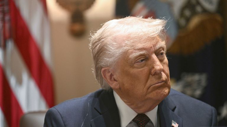 Donald Trump listens during a cabinet meeting in the White House, Monday, March 24, 2025, in Washington. (Pool via AP)