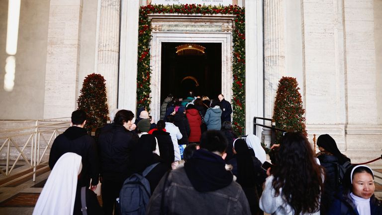 Pilgrims queue to enter through the Holy Door in Saint Peter's Basilica, a day after Pope Francis opened it for the 2025 Catholic Holy Year, or the Jubilee, at the Vatican December 25, 2024. REUTERS/Yara Nardi