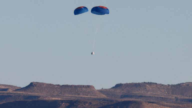 The capsule of a Blue Origin New Shepard rocket carrying a crew of six, including Laura Shepard Churchley, the daughter of the first American in space Alan Shepard, for whom the spacecraft is named, descends by parachute at Launch Site One in west Texas, U.S. December 11, 2021. REUTERS/Joe Skipper