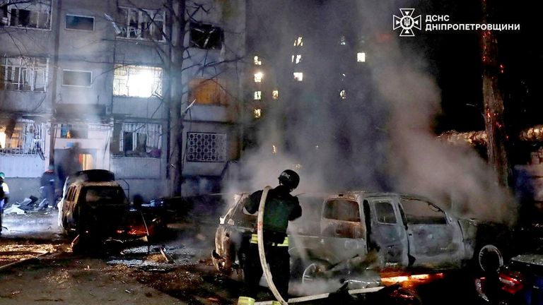 A firefighter extinguishes a burning car at the site of a Russian drone strike, amid Russia's attack on Ukraine, in Dnipro, Ukraine, in this handout picture released April 17, 2025. Press service of the State Emergency Service of Ukraine/Handout via REUTERS    THIS IMAGE HAS BEEN SUPPLIED BY A THIRD PARTY. DO NOT OBSCURE LOGO. BEST QUALITY AVALIABLE.   