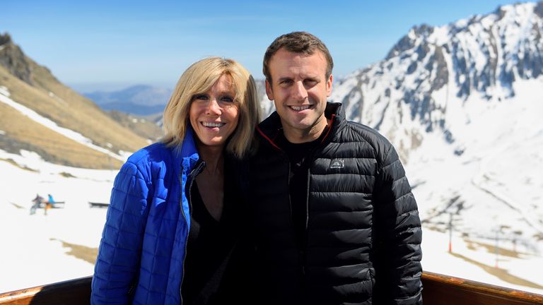 Emmanuel Macron, head of the political movement En Marche ! (Onwards !) and candidate for the 2017 presidential election, and his wife Brigitte Trogneux pose during a lunch break as part of a campaign visit in Bagneres de Bigorre, in the Pyrenees mountain, France, April 12, 2017. Picture taken April 12, 2017. REUTERS/Eric Feferberg/Pool
