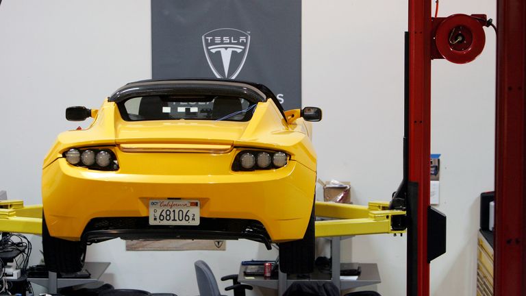 A Tesla Roadster is shown at Tesla Motors in San Carlos, California June 30, 2008. Elon Musk, the chief executive and major investor behind Tesla Motors Inc, has sometimes taunted U.S. automakers, painting his fledgling company as everything Detroit would like to be if it could start over: cooler, greener and ensconced in a much better neighborhood. Picture taken June 30, 2008. To match Special Report TESLA/ REUTERS/Robert Galbraith/Files (UNITED STATES - Tags: TRANSPORT ENVIRONMENT BUSINESS)