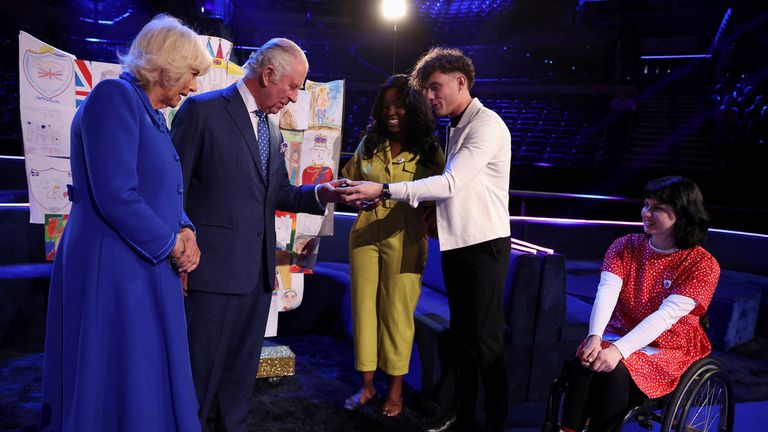 King Charles and Camilla meet the presenters of Blue Peter as they are presented with their badges. Pic: AP