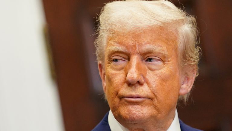 Donald Trump attends in the Roosevelt Room at the White House.
Pic: Reuters