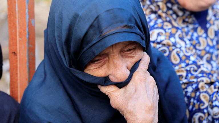 A woman reacts following the death of Palestinians after alleged Israeli fire near a distribution site in Rafah