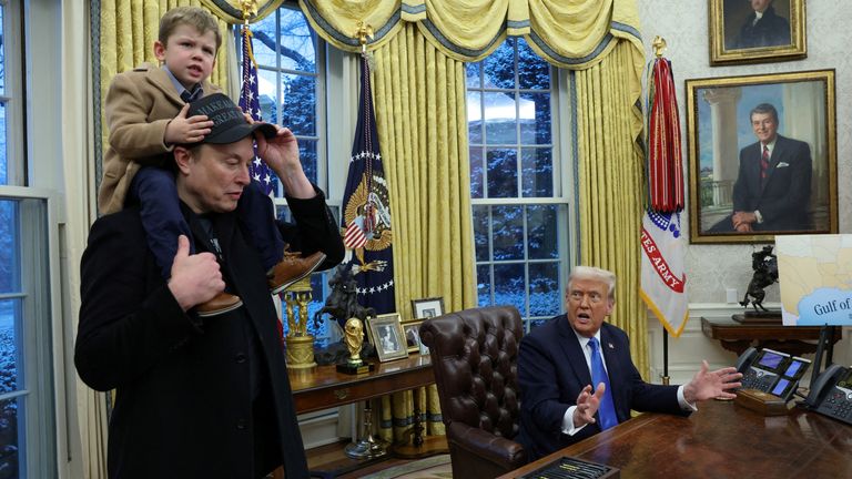 U.S. President Donald Trump speaks as Elon Musk carries X Æ A-12 on his shoulders in the Oval Office of the White House in Washington, D.C., U.S., February 11, 2025.   REUTERS/Kevin Lamarque     TPX IMAGES OF THE DAY  